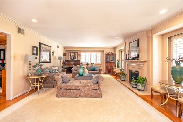 Fireplace, Interior, Living room, Piano, Recessed Lighting, Wood Texture Flooring