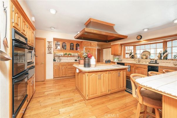 Interior, Kitchen, Recessed Lighting, Tile Countertops, Wood Texture Flooring