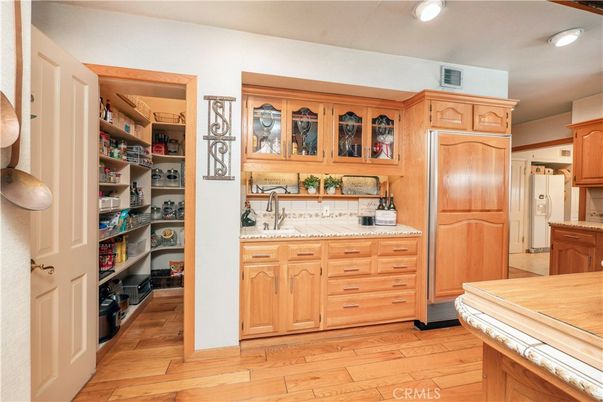Interior, Kitchen, Recessed Lighting, Tile Countertops, Wood Texture Flooring