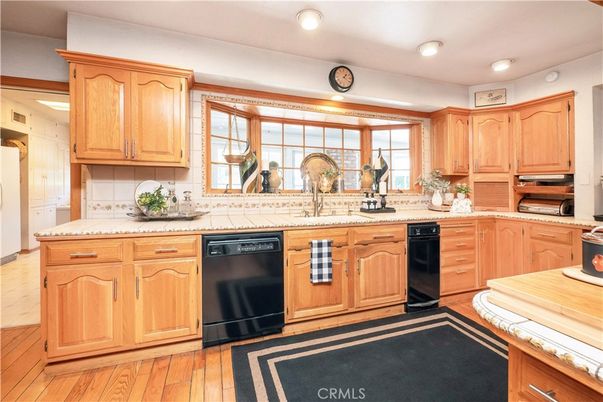 Interior, Kitchen, Recessed Lighting, Tile Countertops, Wood Texture Flooring