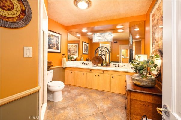 Bathroom, Dual Sink Vanities, Interior, Recessed Lighting, Tile Countertops
