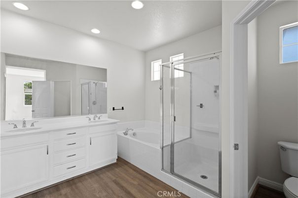 Bathroom, Dual Sink Vanities, Glass Shower, Interior, Recessed Lighting, Wood Texture Flooring