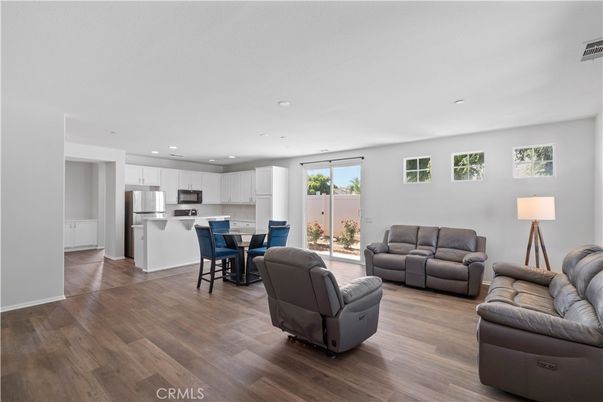 Dining room, Interior, Kitchen, Living room, Recessed Lighting, Stainless Steel Appliances, Wood Texture Flooring