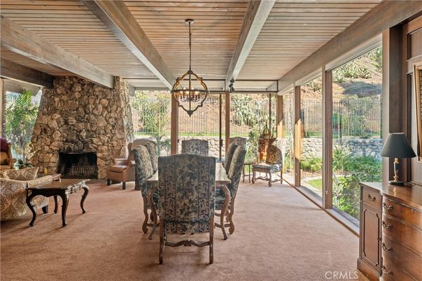 Chandelier, Dining room, Fireplace, Interior, Stone Walls, Sun Room, Wooden Ceilings