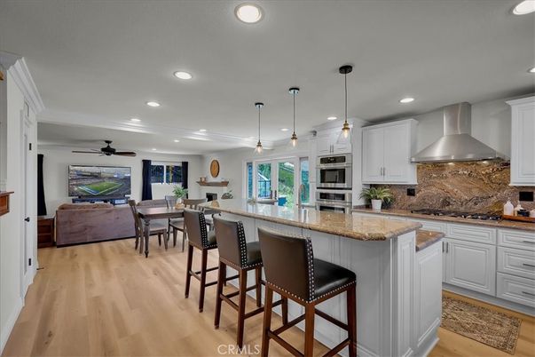 Dining room, Interior, Kitchen, Living room, Pendant Lights, Recessed Lighting, Stainless Steel Appliances, Wood Texture Flooring