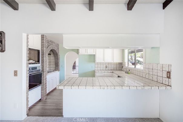 Interior, Kitchen, Tile Countertops, Wooden Beams, Wood Texture Flooring