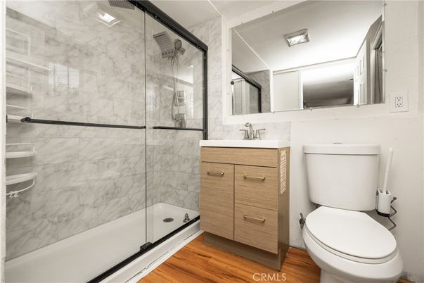 Bathroom, Glass Shower, Interior, Marble Walls, Wood Texture Flooring