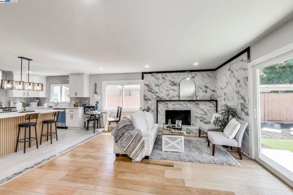 Dining room, Fireplace, Interior, Kitchen, Living room, Marble Walls, Pendant Lights, Recessed Lighting, Wood Texture Flooring