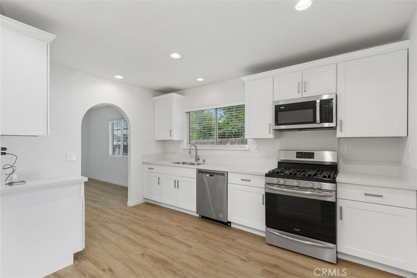 Interior, Kitchen, Recessed Lighting, Stainless Steel Appliances, Wood Texture Flooring