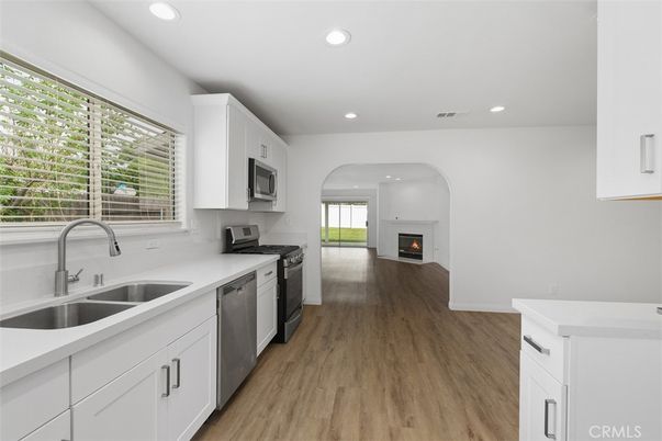 Fireplace, Interior, Kitchen, Recessed Lighting, Wood Texture Flooring