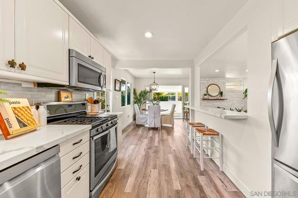 Dining room, Interior, Kitchen, Pendant Lights, Recessed Lighting, Stainless Steel Appliances, Stone Walls, Wood Texture Flooring