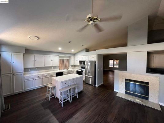Fireplace, Interior, Kitchen, Recessed Lighting, Stainless Steel Appliances, Wood Texture Flooring