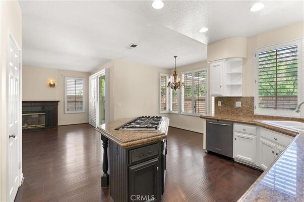 Chandelier, Fireplace, Interior, Kitchen, Recessed Lighting, Wood Texture Flooring