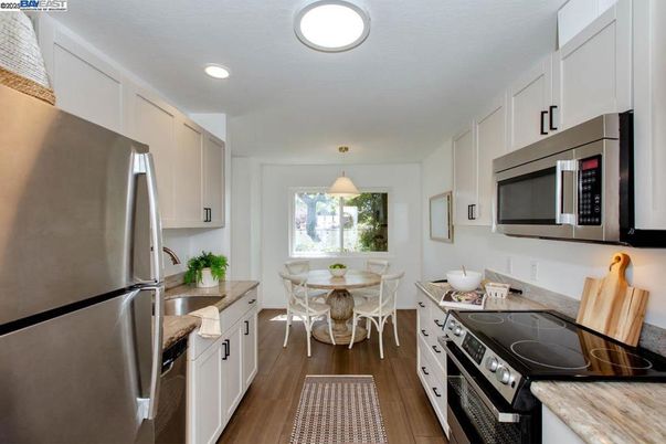 Dining room, Interior, Kitchen, Pendant Lights, Recessed Lighting, Stainless Steel Appliances, Wood Texture Flooring
