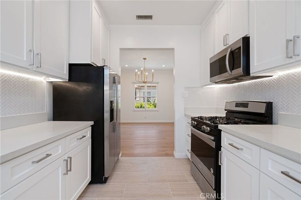 Chandelier, Interior, Kitchen, Recessed Lighting, Stainless Steel Appliances, Wood Texture Flooring