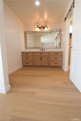 Bathroom, Dual Sink Vanities, Interior, Recessed Lighting, Wood Texture Flooring