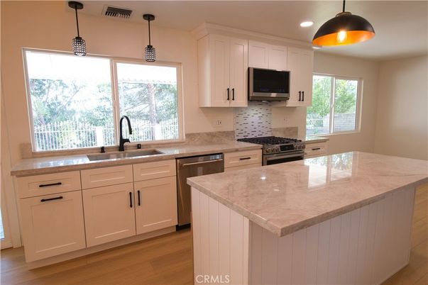 Interior, Kitchen, Pendant Lights, Recessed Lighting, Stainless Steel Appliances, Wood Texture Flooring