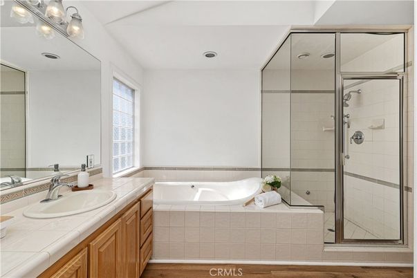 Bathroom, Glass Shower, Interior, Recessed Lighting, Tile Countertops, Wood Texture Flooring