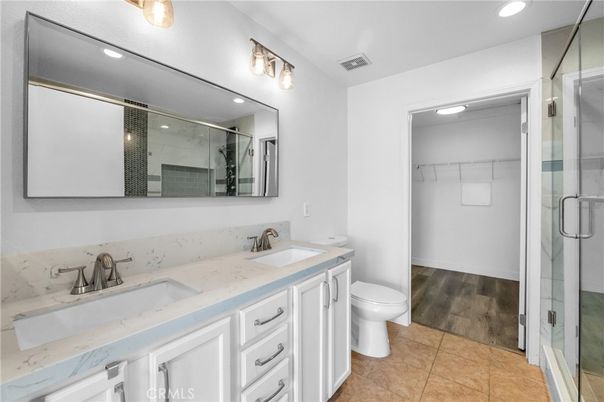Bathroom, Dual Sink Vanities, Glass Shower, Interior, Recessed Lighting, Wood Texture Flooring