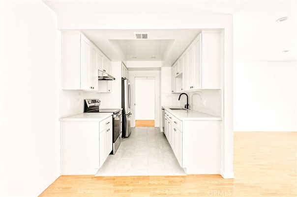 Interior, Kitchen, Recessed Lighting, Washer, Wood Texture Flooring