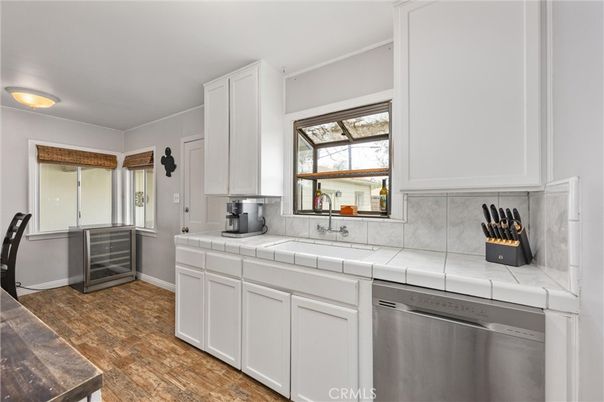 Interior, Kitchen, Stainless Steel Appliances, Tile Countertops, Wood Texture Flooring