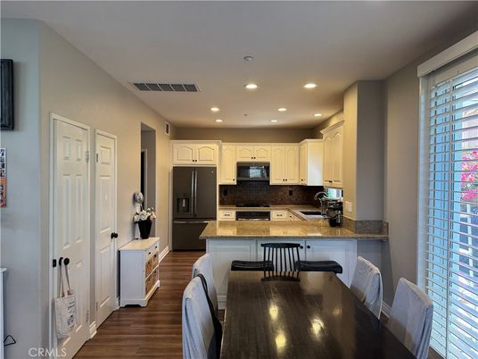 Dining room, Interior, Kitchen, Recessed Lighting, Stainless Steel Appliances, Wood Texture Flooring