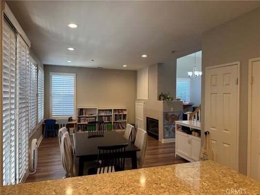 Chandelier, Dining room, Fireplace, Interior, Recessed Lighting, Wood Texture Flooring