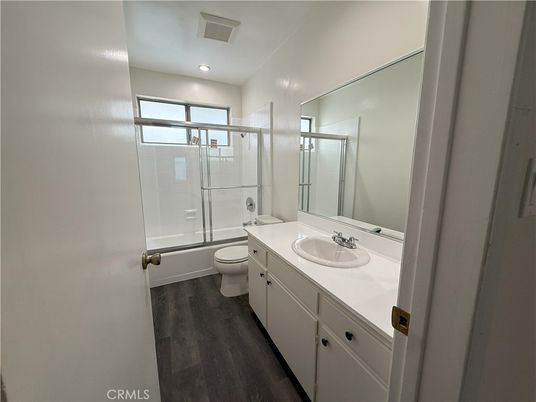 Bathroom, Dual Sink Vanities, Glass Shower, Interior, Recessed Lighting, Wood Texture Flooring