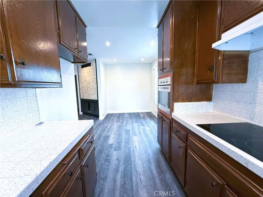 Interior, Kitchen, Recessed Lighting, Tile Countertops, Wood Texture Flooring