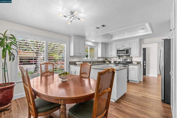 Dining room, Interior, Kitchen, Recessed Lighting, Stainless Steel Appliances, Wood Texture Flooring