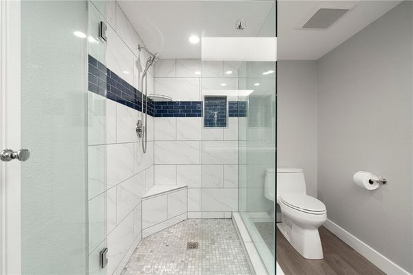 Bathroom, Glass Shower, Interior, Marble Walls, Recessed Lighting, Wood Texture Flooring