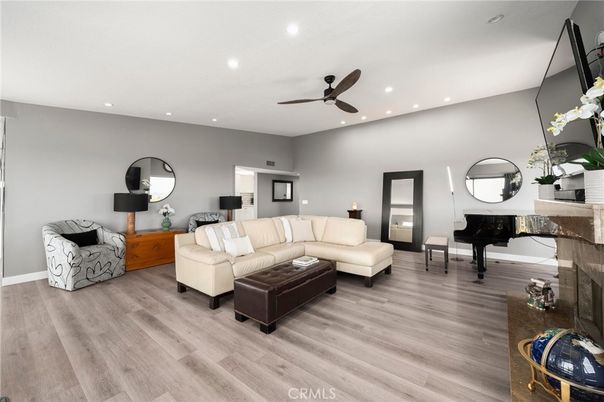 Fireplace, Interior, Living room, Piano, Recessed Lighting, Wood Texture Flooring