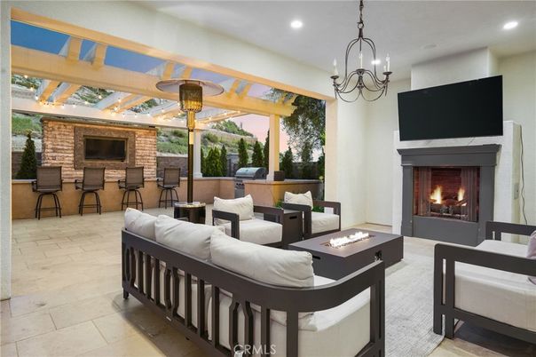Chandelier, Fireplace, Interior, Living room, Recessed Lighting, Stone Walls