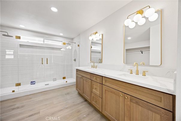 Bathroom, Dual Sink Vanities, Glass Shower, Interior, Recessed Lighting, Wood Texture Flooring