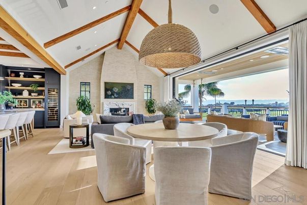 Dining room, Fireplace, Interior, Living room, Recessed Lighting, Water, Wooden Beams, Wood Texture Flooring