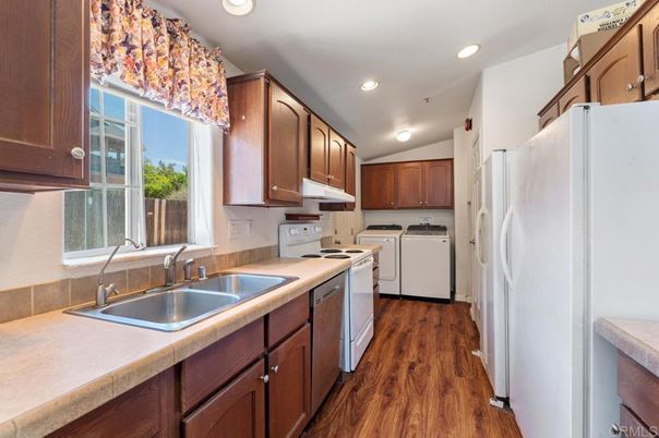 Interior, Kitchen, Recessed Lighting, Washer, Wood Texture Flooring