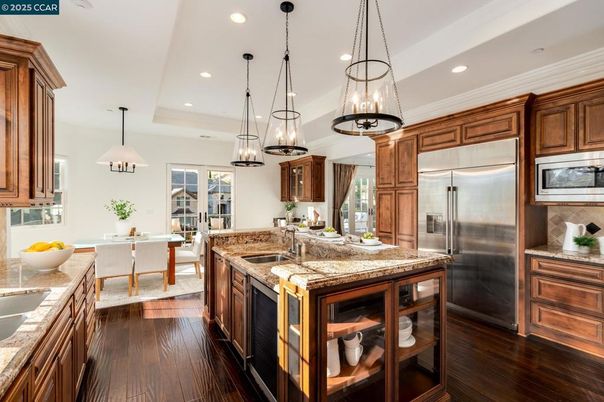 Dining room, Interior, Kitchen, Pendant Lights, Recessed Lighting, Stainless Steel Appliances, Wood Texture Flooring