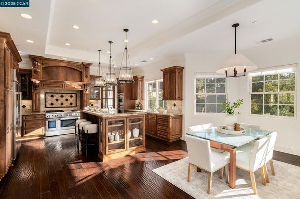 Dining room, Interior, Kitchen, Pendant Lights, Recessed Lighting, Stainless Steel Appliances, Wood Texture Flooring