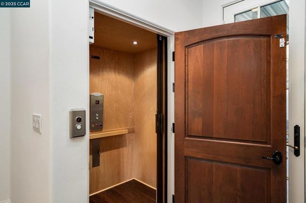 Elevator, Interior, Recessed Lighting, Wood Texture Flooring, Wooden Walls