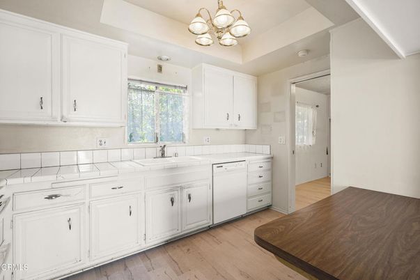 Chandelier, Interior, Kitchen, Tile Countertops, Wood Texture Flooring