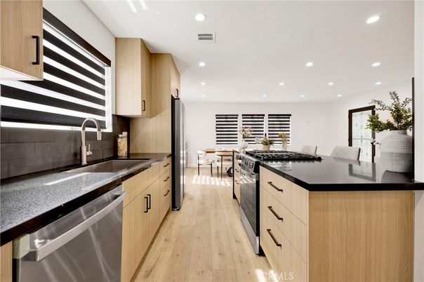 Dining room, Interior, Kitchen, Recessed Lighting, Stainless Steel Appliances, Wood Texture Flooring