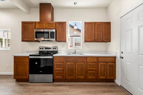 Interior, Kitchen, Pendant Lights, Recessed Lighting, Stainless Steel Appliances, Wood Texture Flooring