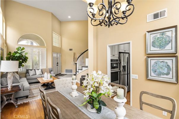 Chandelier, Dining room, Interior, Kitchen, Living room, Recessed Lighting, Stainless Steel Appliances, Wood Texture Flooring
