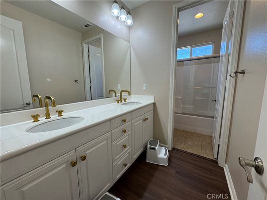 Bathroom, Dual Sink Vanities, Glass Shower, Interior, Wood Texture Flooring