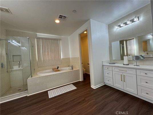 Bathroom, Dual Sink Vanities, Glass Shower, Interior, Recessed Lighting, Wood Texture Flooring