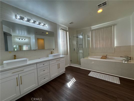 Bathroom, Dual Sink Vanities, Glass Shower, Interior, Recessed Lighting, Wood Texture Flooring