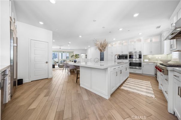 Dining room, Interior, Kitchen, Recessed Lighting, Stainless Steel Appliances, Wood Texture Flooring