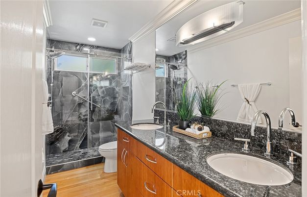 Bathroom, Dual Sink Vanities, Glass Shower, Interior, Recessed Lighting, Wood Texture Flooring