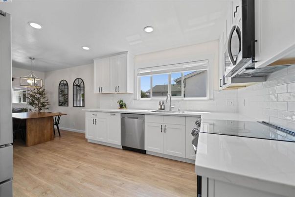 Dining room, Interior, Kitchen, Pendant Lights, Recessed Lighting, Stainless Steel Appliances, Wood Texture Flooring