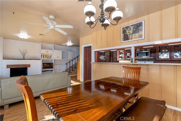 Chandelier, Dining room, Fireplace, Interior, Kitchen, Wood Texture Flooring